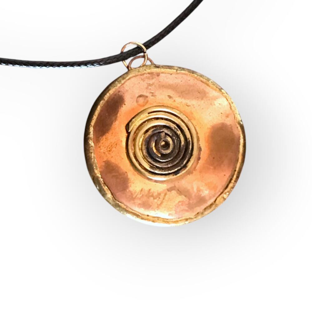 Copper tone mixed metal circular pendant necklace, waxed black cotton cord